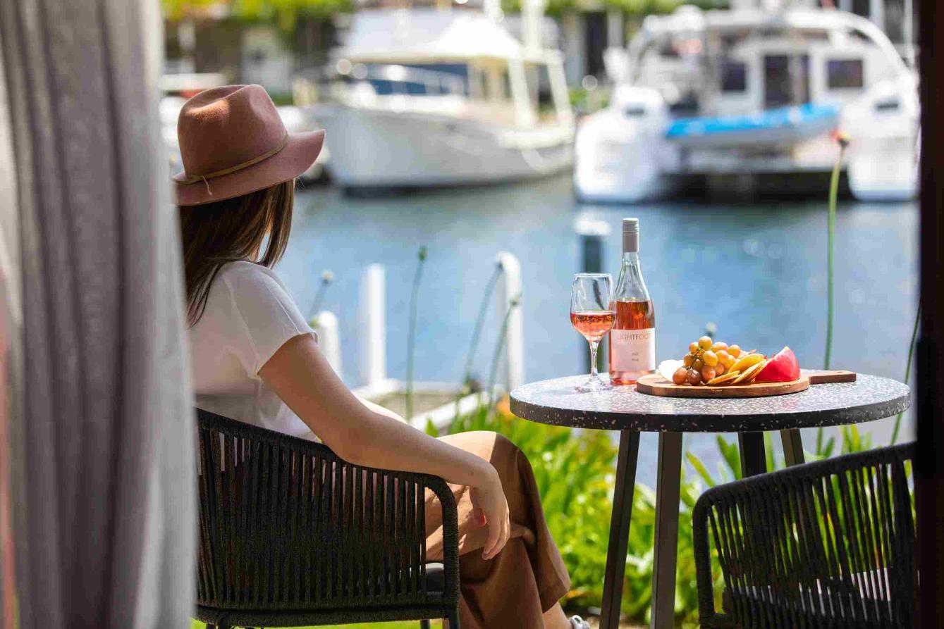 A Mariners Cove guest enjoying water front views from their room